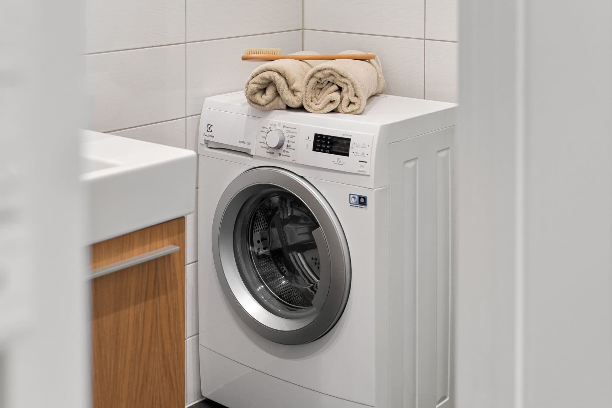 Washing machine plumbed in beside a sink