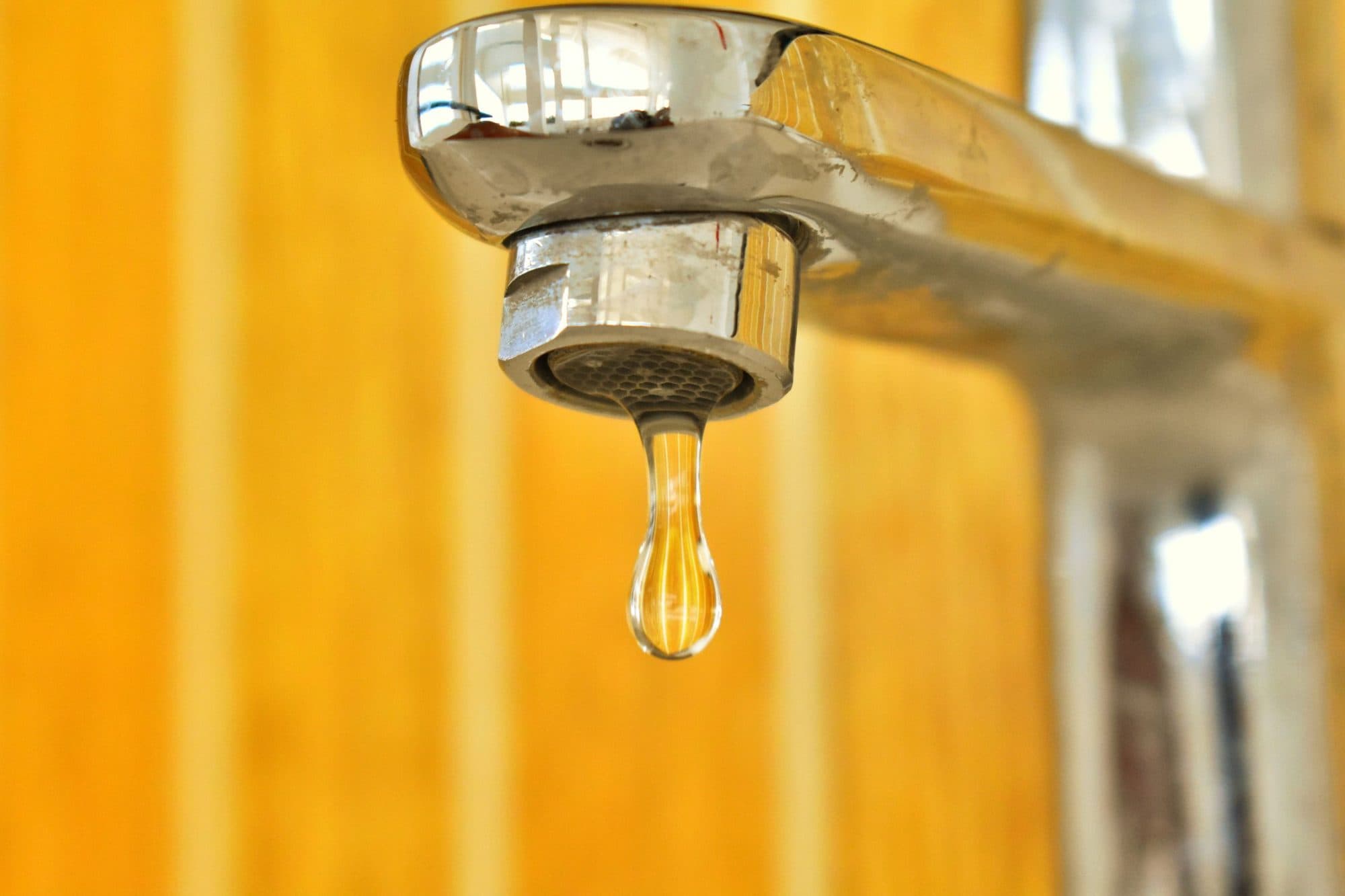 Close-up of a dripping tap